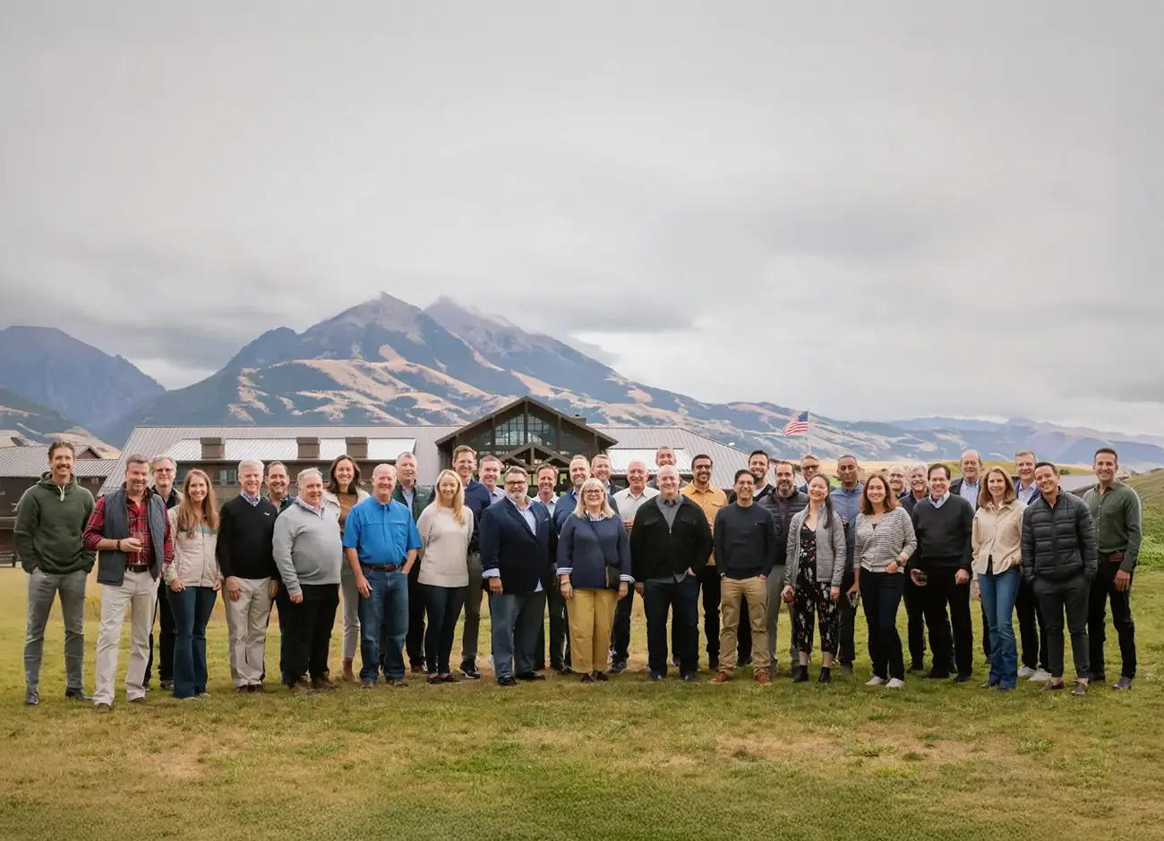Group photo with mountains in the background